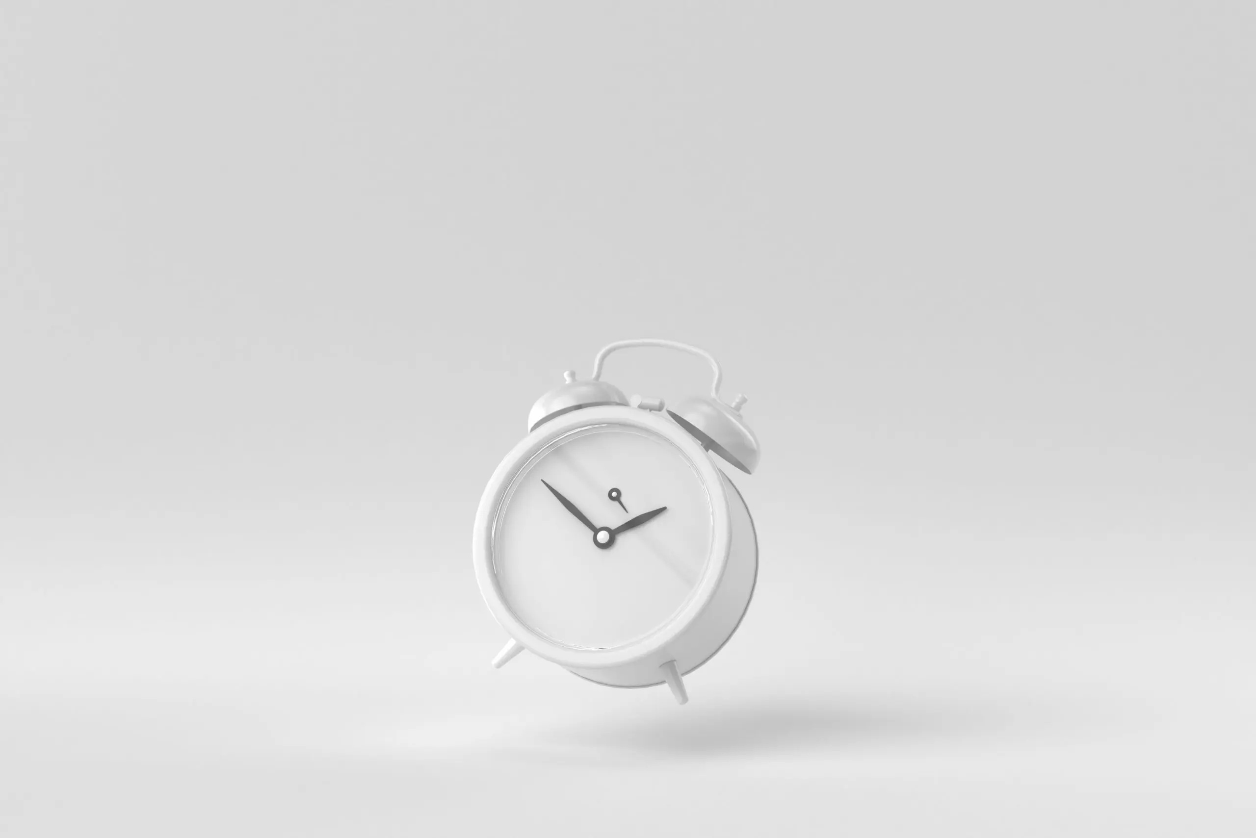 White alarm clock on neutral background representing fast turnaround time for online skin diagnosis.